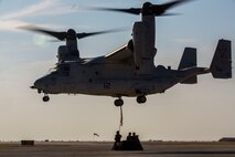 A U.S. Marine Corps MV-22B Osprey with Special Purpose Marine Air-Ground Task Force-Crisis Response-Africa 19.2, Marine Forces Europe and Africa, conducts an external lift during helicopter support team training on Moron Air Base, Spain, July 9, 2019. The exercise was conducted to increase interoperability between the aviation combat element and logistics combat element. SPMAGTF-CR-AF is deployed to conduct crisis-response and theater-security operations in Africa and promote regional stability by conducting military-to-military training exercises throughout Europe and Africa. (U.S. Marine Corps photo by Cpl. Margaret Gale)