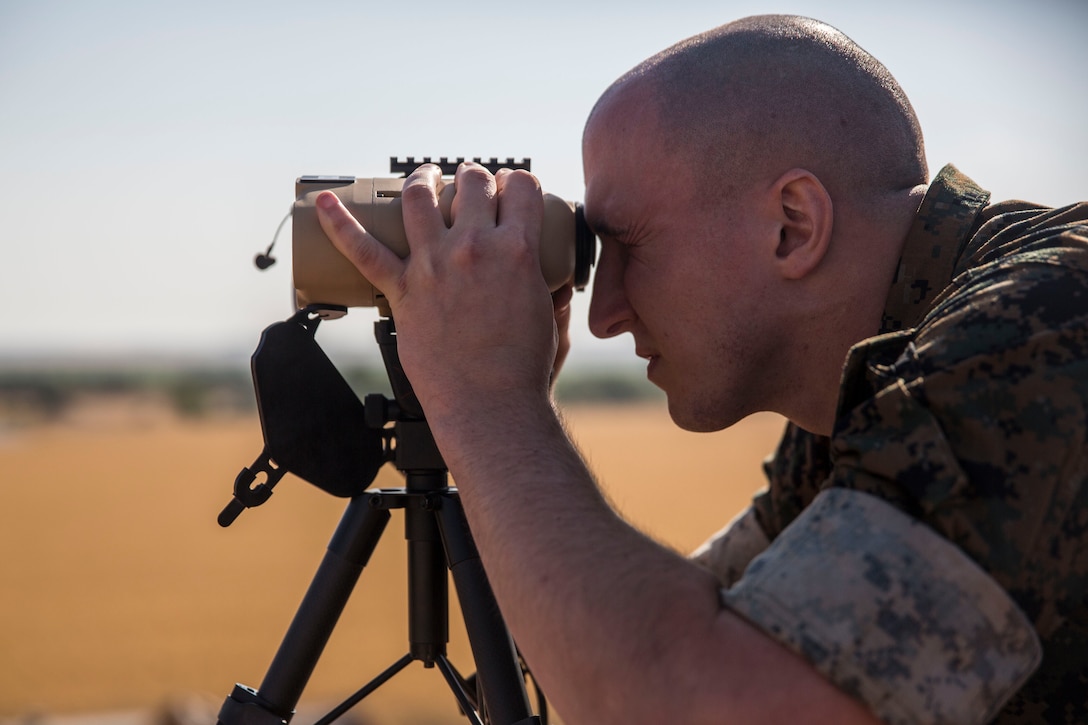 A U.S. Marine with Special Purpose Marine Air-Ground Task Force-Crisis Response-Africa 19.2, Marine Forces Europe and Africa, practices a call for fire during a close-air support training exercise with Spanish air force pilots at Moron Air Base, Spain, July 9, 2019. SPMAGTF-CR-AF 19.2 is deployed to conduct crisis-response and theater-security operations in Africa and promote regional stability by conducting military-to-military training exercises throughout Europe and Africa. (U.S. Marine Corps photo by Cpl. Margaret Gale)