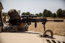 A U.S. Marine with Special Purpose Marine Air-Ground Task Force-Crisis Response-Africa 19.2, Marine Forces Europe and Africa, provides security during an entry control point training rehearsal on Moron Air Base, Spain, July 11, 2019. Marines practiced vehicle control and entry control point procedures used to identify and search vehicles and personnel. SPMAGTF-CR-AF 19.2 is deployed to conduct crisis-response and theater-security operations in Africa and promote regional stability by conducting military-to-military training exercises throughout Europe and Africa. (U.S. Marine Corps photo by Cpl. Margaret Gale)