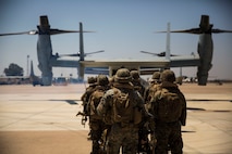 U.S. Marines with Special Purpose Marine Air-Ground Task Force-Crisis Response-Africa 19.2, Marine Forces Europe and Africa, prepare to board a U.S. Marine Corps MV-22B Osprey on Moron Air Base, Spain, July 15, 2019, during a tactical recovery of aircraft and personnel training exercise. TRAP is a core function of a crisis-response force and SPMAGTF-CR-AF 19.2 consistently trains to increase TRAP proficiency by rehearsing realistic scenarios which force the Marines and Sailors to make quick decisions under stress. SPMAGTF-CR-AF is deployed to conduct crisis-response and theater-security operations in Africa and promote regional stability by conducting military-to-military training exercises throughout Europe and Africa. (U.S. Marine Corps photo by Cpl. Margaret Gale)