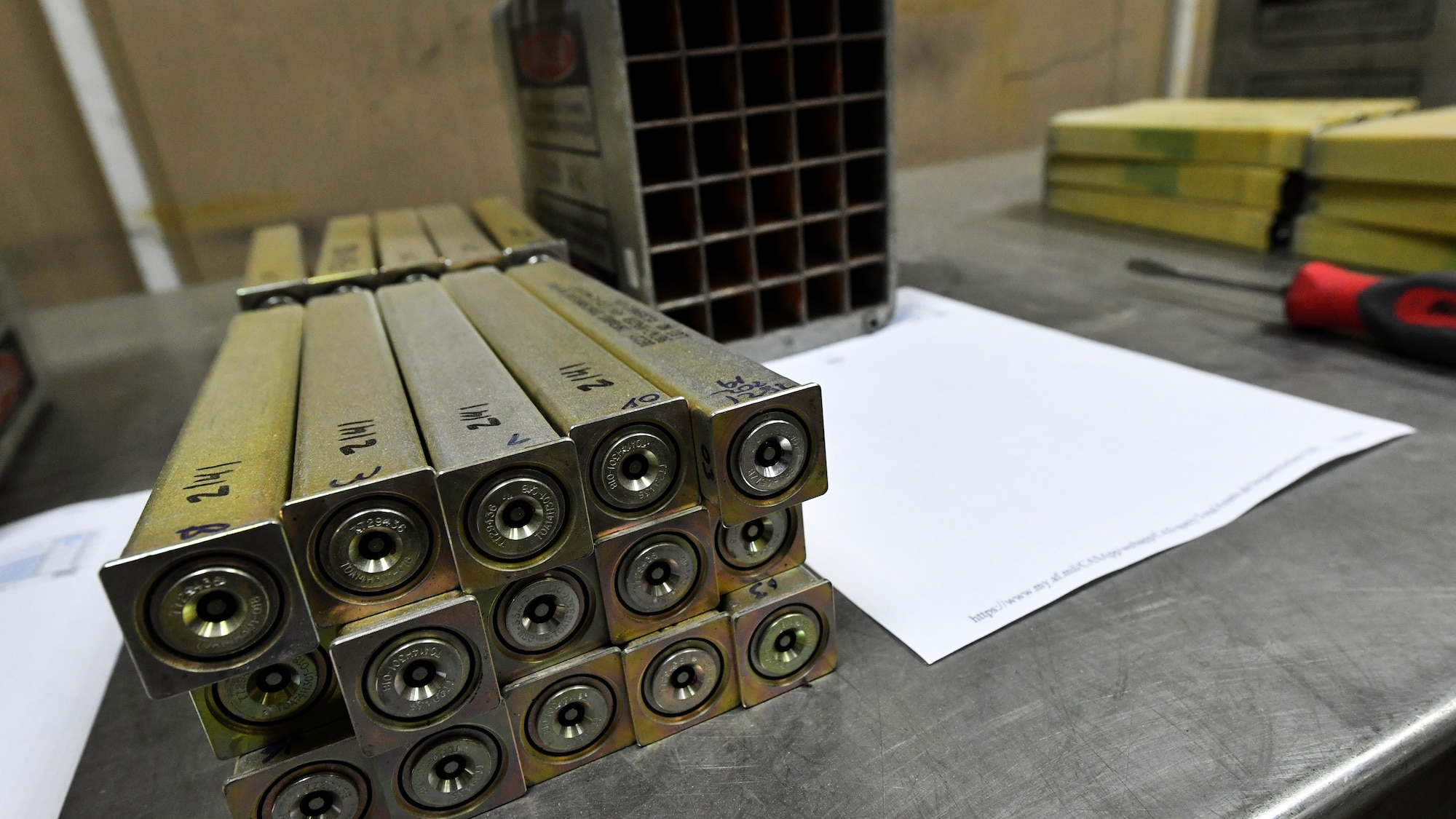 Aircraft flares await inspection and installation into a flare housing module at Ali Al Salem Air Base, Kuwait, July 18, 2019. Flares and chaff are routinely inspected to verify expiration dates, guaranteeing proper functionality in the event countermeasures are needed during operations. (U.S. Air Force photo by Staff. Sgt. Mozer O. Da Cunha)
