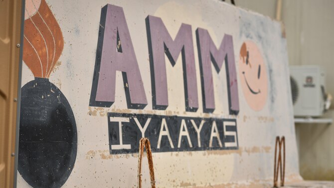 An ammunitions sign marks the entrance of the munitions storage area at Ali Al Salem Air Base, Kuwait, July 18, 2019. Ammunition Airmen from the 386th Expeditionary Maintenance Squadron are responsible for the munitions stockpile. Various duties include shipping and receiving, building, testing, operating, protecting, inspecting, storing and performing maintenance on all types of conventional munition systems. (U.S. Air Force photo by Staff. Sgt. Mozer O. Da Cunha)