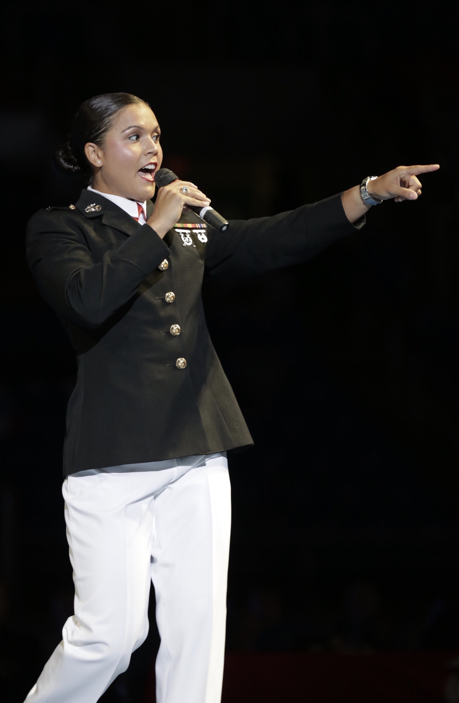 1st Lt. Stephanie Simon addresses the crowd at the US Marine Corps Cadet and Junior National Championships in Fargo, North Dakota, July 17, 2019. USA Wrestling (USAW) is the national governing body for the sport of wrestling and is the central organization that coordinates amateur wrestling programs in the nation and works to create interest and participation in these programs. The Marine Corps began partnering with USAW in 2017 to become intimately involved with the sport of wrestling through event activations, event branding and brand exposure through media. By partnering specifically with USAW, the Marine Corps reaches a broad cross-section of high school and collegiate-aged wrestlers as well as an ever-growing influencer network of coaches, referees, wrestling alumni and parents. Simon is an Assault Amphibian Officer for 2nd Assault Amphibian Battalion on Marine Corps Base Camp Lejeune, North Carolina and is also a wrestler and boxer.  (US Marine Corps photo by Cpl. Naomi May)