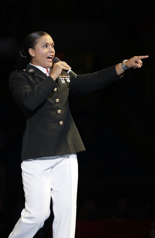 1st Lt. Stephanie Simon addresses the crowd at the US Marine Corps Cadet and Junior National Championships in Fargo, North Dakota, July 17, 2019. USA Wrestling (USAW) is the national governing body for the sport of wrestling and is the central organization that coordinates amateur wrestling programs in the nation and works to create interest and participation in these programs. The Marine Corps began partnering with USAW in 2017 to become intimately involved with the sport of wrestling through event activations, event branding and brand exposure through media. By partnering specifically with USAW, the Marine Corps reaches a broad cross-section of high school and collegiate-aged wrestlers as well as an ever-growing influencer network of coaches, referees, wrestling alumni and parents. Simon is an Assault Amphibian Officer for 2nd Assault Amphibian Battalion on Marine Corps Base Camp Lejeune, North Carolina and is also a wrestler and boxer.  (US Marine Corps photo by Cpl. Naomi May)