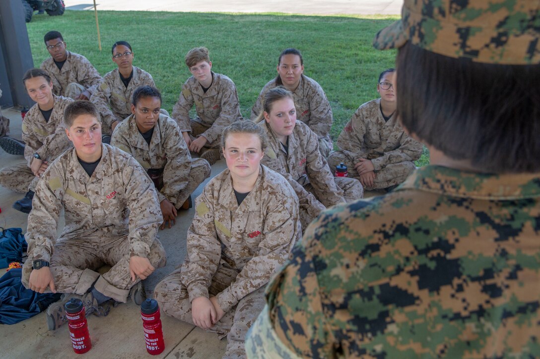 Kira Baker, a student from Tahoe Expedition Academy in Truckee, CA, and Emma Brennan, a student from Moriarty High School in Moriarty, New Mexico, listen to Staff Sgt. Amy White during the Marine Corps’ 2019 Summer Leadership and Character Development Academy (SLCDA) aboard Marine Corps Base Quantico, Virginia, July 17. The Summer Leadership and Character Development Academy is designed to challenge high school students to step outside of their comfort zones and strengthen their confidence and leadership skills while immersing them in Marine Corps culture. The goal of the academy is to return students back to their communities more confident, selfless and better equipped to improve the lives of those around them. (U.S. Marine Corps photo by Lance Cpl. Mitchell Collyer)