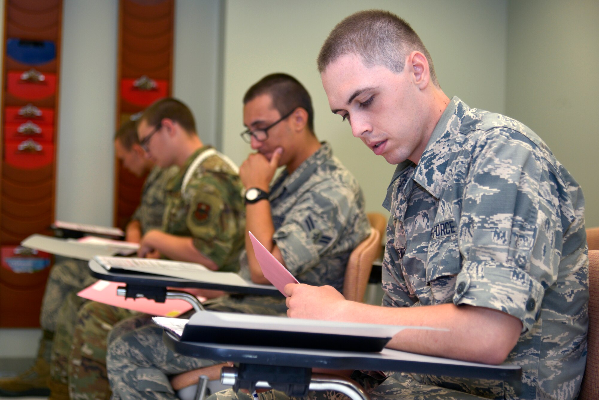 Airmen from the 81st Training Group fill out blood donation applications at the Blood Donor Center at Keesler Air Force Base, Mississippi, July 16, 2019. The Keesler Blood Donor Center provides blood to deployed service members. (U.S. Air Force photo by Airman Seth Haddix)