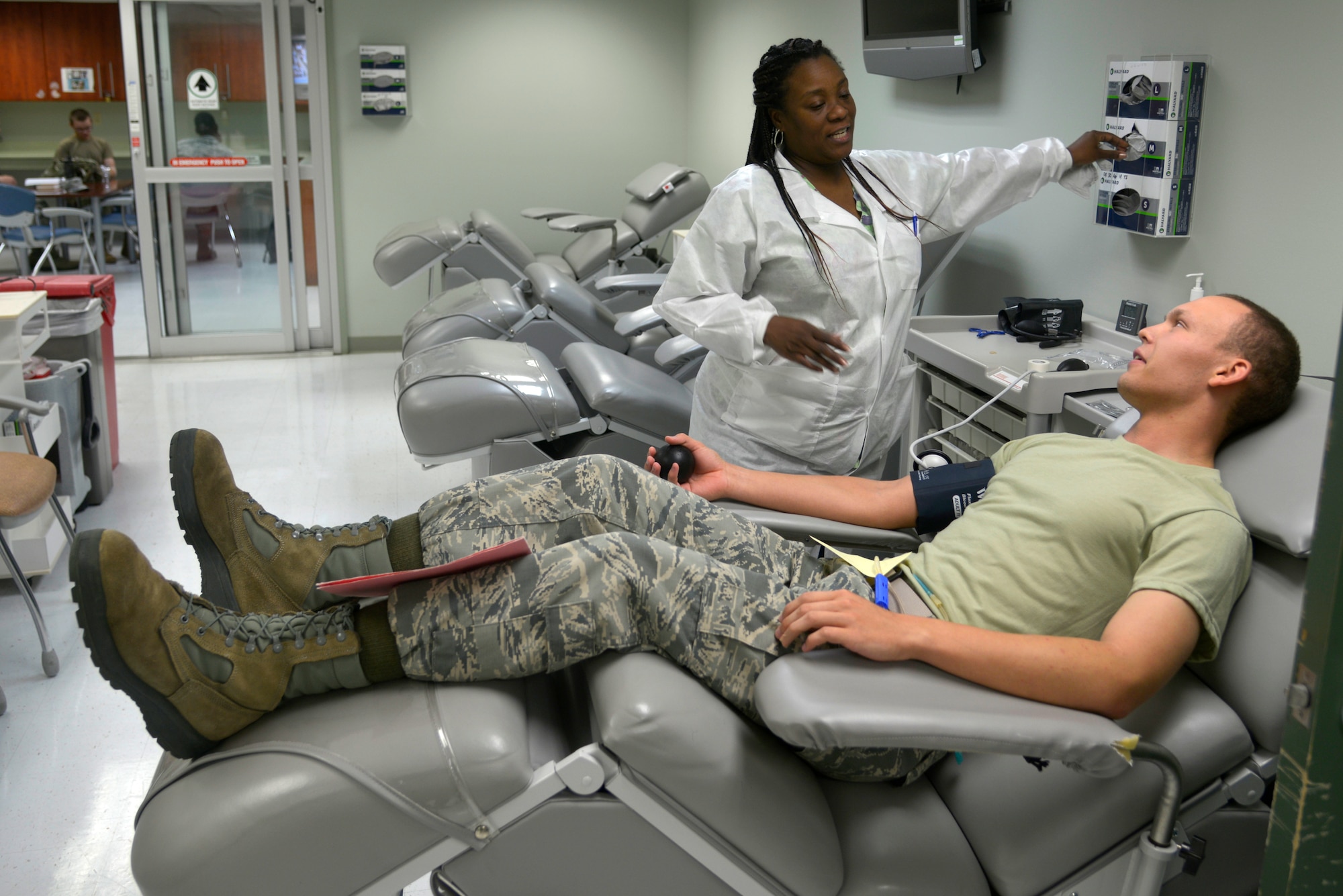 Tarissa Brown, 81st Diagnostics and Therapeutics Squadron lab technician, draws blood from U.S. Air Force Airman Igor Houston, 336th Training Squadron student, at the Blood Donor Center at Keesler Air Force Base, Mississippi, July 16, 2019. The Keesler Blood Donor Center provides blood to deployed service members. (U.S. Air Force photo by Airman Seth Haddix)