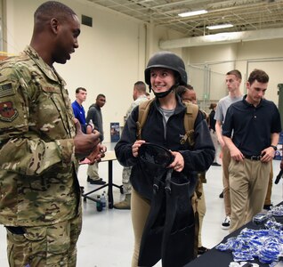 Tech. Sgt. Cornelius Bostic (left), 330th Special Warfare Recruiting Squadron recruiter, briefs Claire Stewart (right), University of Houston Air Force ROTC cadet, on equipment worn by special operations members during the fifth annual Pathways to Blue on Keesler Air Force Base, Mississippi, April 5. Pathways to Blue is a diversity outreach event hosted by Second Air Force with the support of the 81st Training Wing and the 403rd Wing.