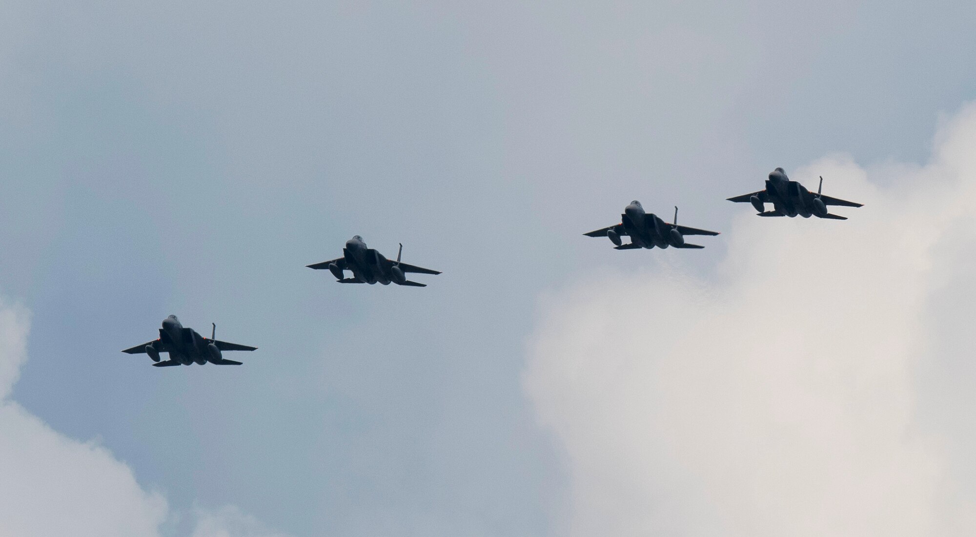 Four F-15C Eagles assigned to the 493rd Fighter Squadron return to Royal Air Force Lakenheath, England, July 12, 2019. Members from the 493rd FS and 748th Aircraft Maintenance Squadron were deployed to an undisclosed location for six months. (U.S. Air Force photo by Senior Airman Malcolm Mayfield)