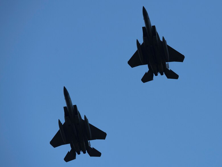Two F-15C Eagles assigned to the 493rd Fighter Squadron return to Royal Air Force Lakenheath, England, July 12, 2019. Members of the 493rd FS and 748th Aircraft Maintenance Squadron were deployed to an undisclosed location for six months. (U.S. Air Force photo by Senior Airman Malcolm Mayfield)
