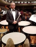Idaho Army National Guard Chief Warrant Officer 2 Micah Strasser poses for a photo next to his timpani during  a dress rehearsal for a Millennial Choirs and Orchestras performance at New York City's Carnegie Hall July 11, 2019.