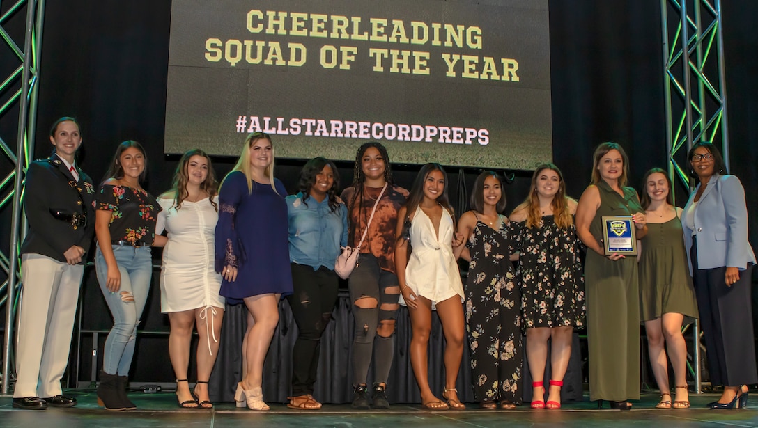 U.S. Marine Capt. Rachel Baker presents the Cheerleading Squad of the Year during the Best of Preps awards ceremony. The ceremony celebrates and honors the accomplishments of the 2018-2019 All-Star high school student athletes.