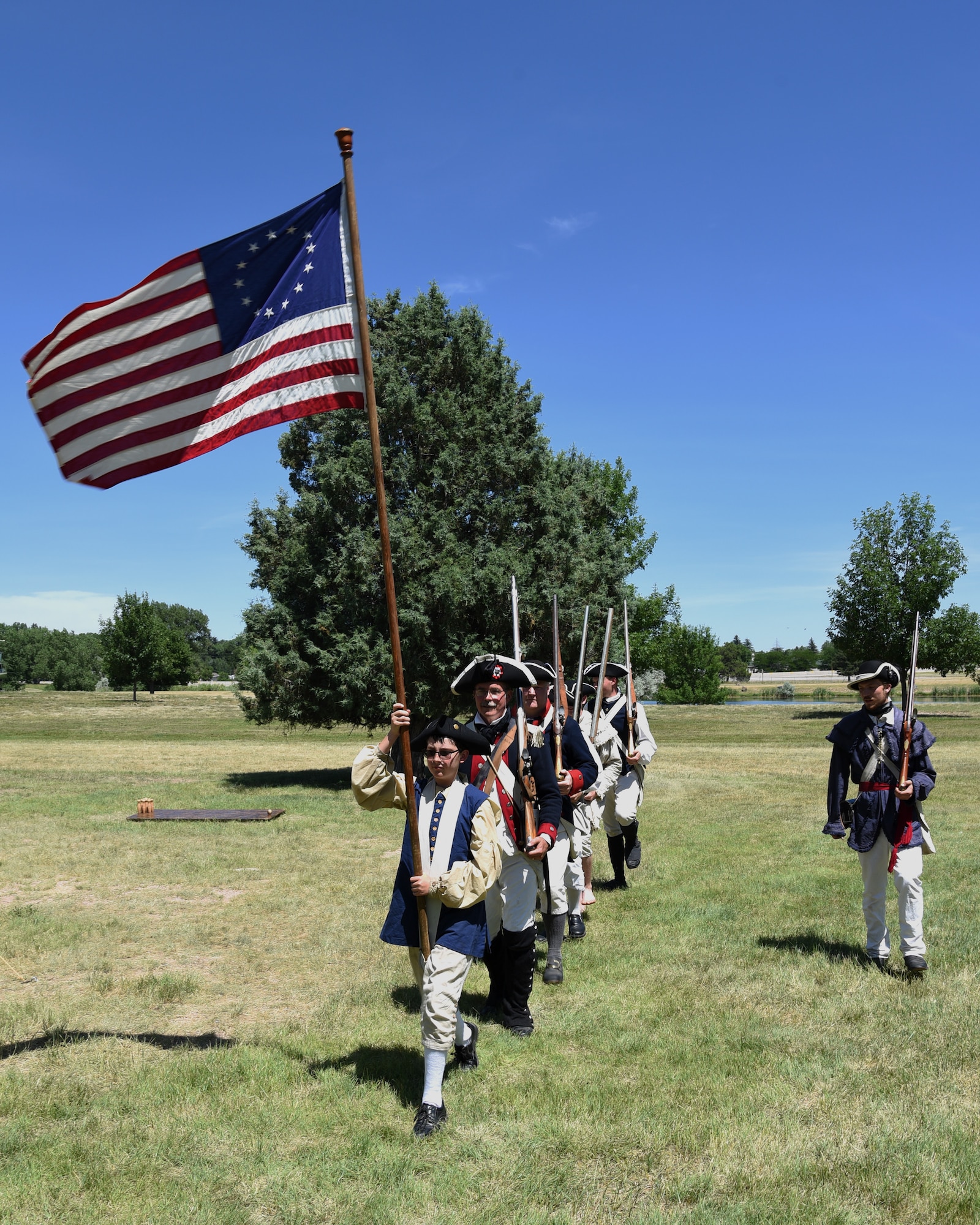 Revolutionary War reenactors march into position for a demonstration at F.E. Warren Air Force Base, Wyo., July 20, 2019 as part of the annual Fort D.A. Russell Days. D. A. Russell Days allows the base to showcase the current mission while also giving visitors a realistic glimpse of the base’s history. This year marks the 25th iteration of the event. (U.S. Air Force photo by Glenn S. Robertson)