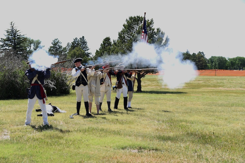Continental Army Revolutionary War reenactors fire on British Redcoats during a demonstration at F.E. Warren Air Force Base, Wyo., July 20, 2019 as part of the annual Fort D.A. Russell Days. D. A. Russell Days allows the base to showcase the current mission while also giving visitors a realistic glimpse of the base’s history. This year marks the 25th iteration of the event. (U.S. Air Force photo by Glenn S. Robertson)