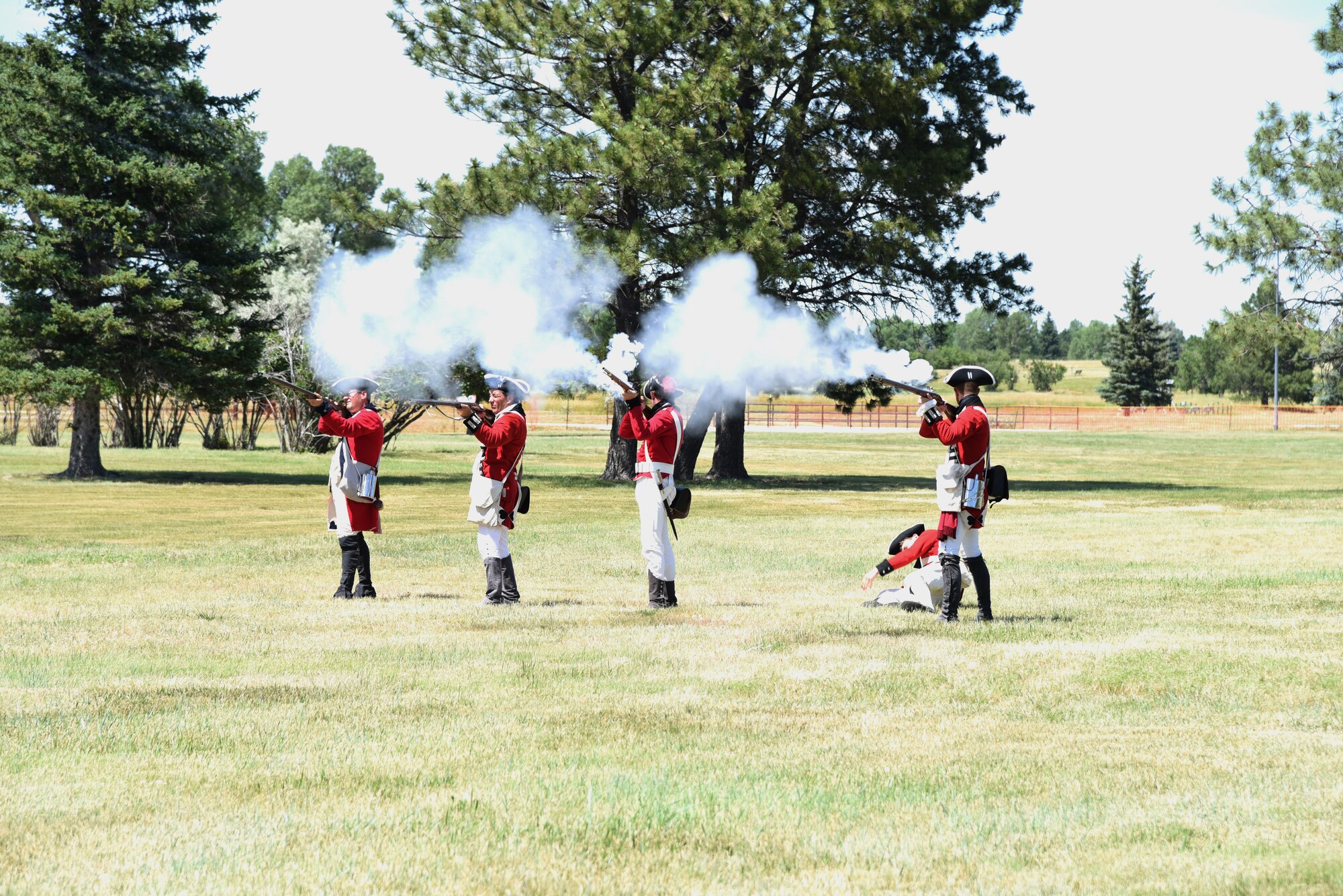 British Army Revolutionary War reenactors fire on Continental Soldiers during a demonstration at F.E. Warren Air Force Base, Wyo., July 20, 2019 as part of the annual Fort D.A. Russell Days. D. A. Russell Days allows the base to showcase the current mission while also giving visitors a realistic glimpse of the base’s history. This year marks the 25th iteration of the event. (U.S. Air Force photo by Glenn S. Robertson)