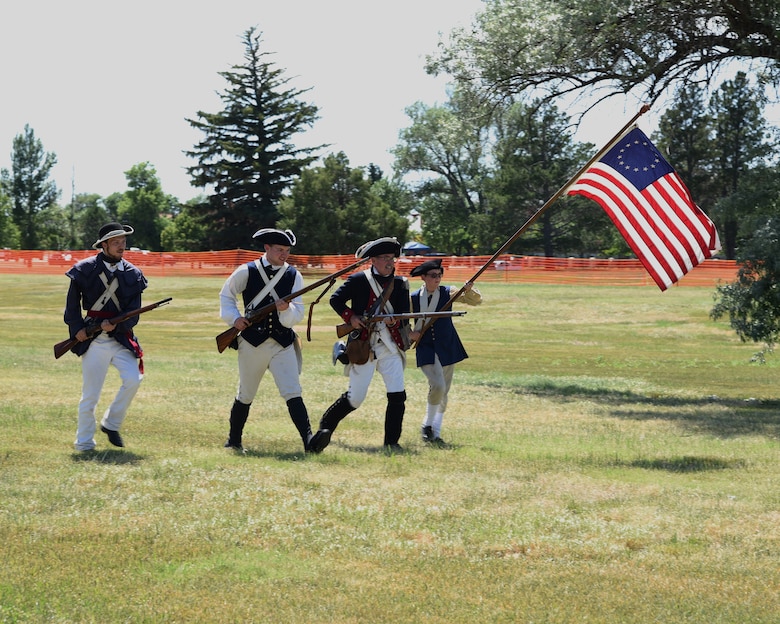 Continental Army Revolutionary War reenactors "fix bayonets" and charge British Redcoats during a demonstration at F.E. Warren Air Force Base, Wyo., July 20, 2019 as part of the annual Fort D.A. Russell Days. D. A. Russell Days allows the base to showcase the current mission while also giving visitors a realistic glimpse of the base’s history. This year marks the 25th iteration of the event. (U.S. Air Force photo by Glenn S. Robertson)