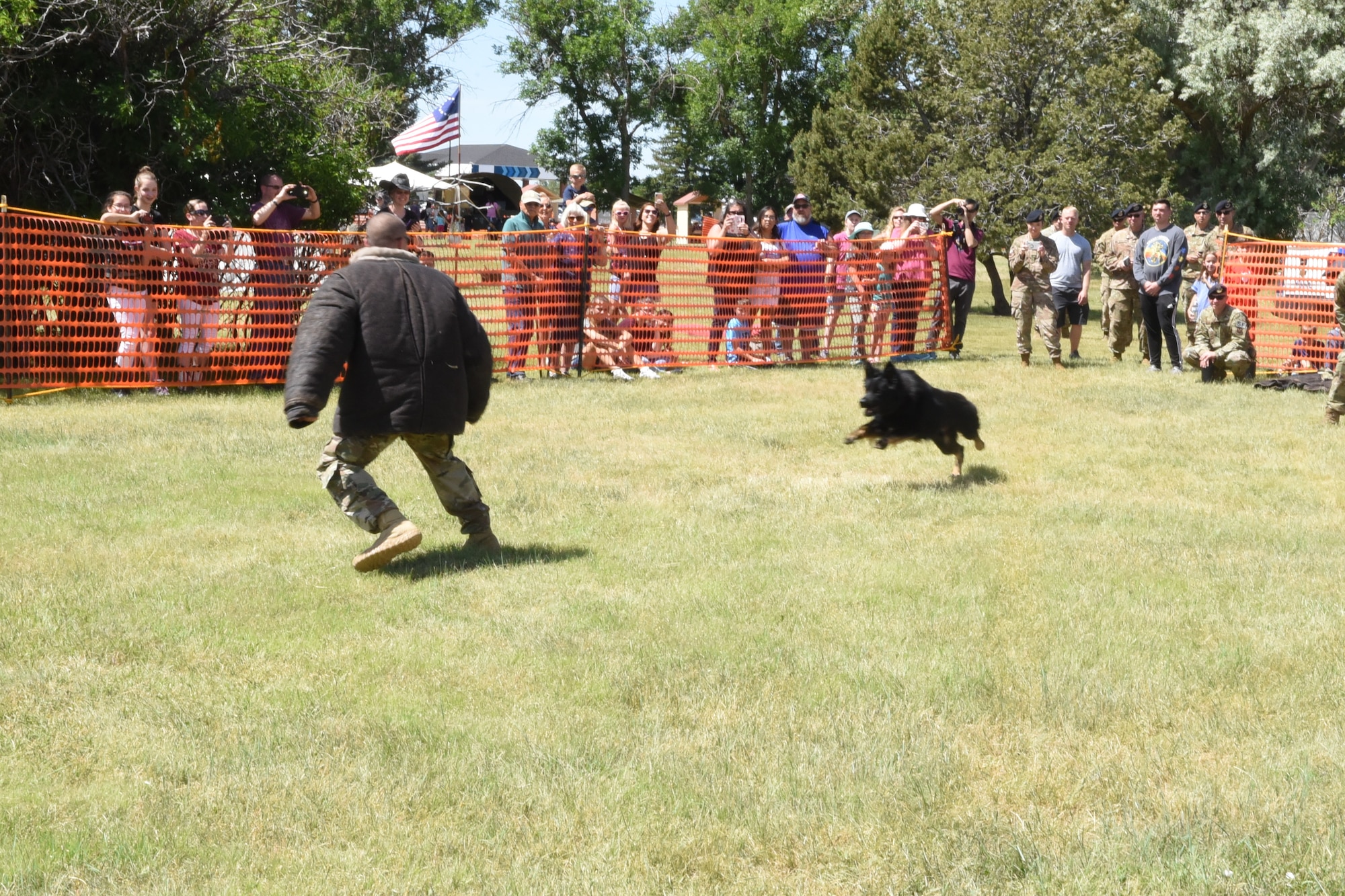 Staff Sgt. Curtis Shannon, 90th Security Forces Squadron military working dog handler, demonstrates Rio’s K-9 capabilities during an exhibition at Fort D.A. Russell Days on F.E. Warren Air Force Base, Wyo., July 19, 2019. (U.S. Air Force photo by Terry Higgins)
