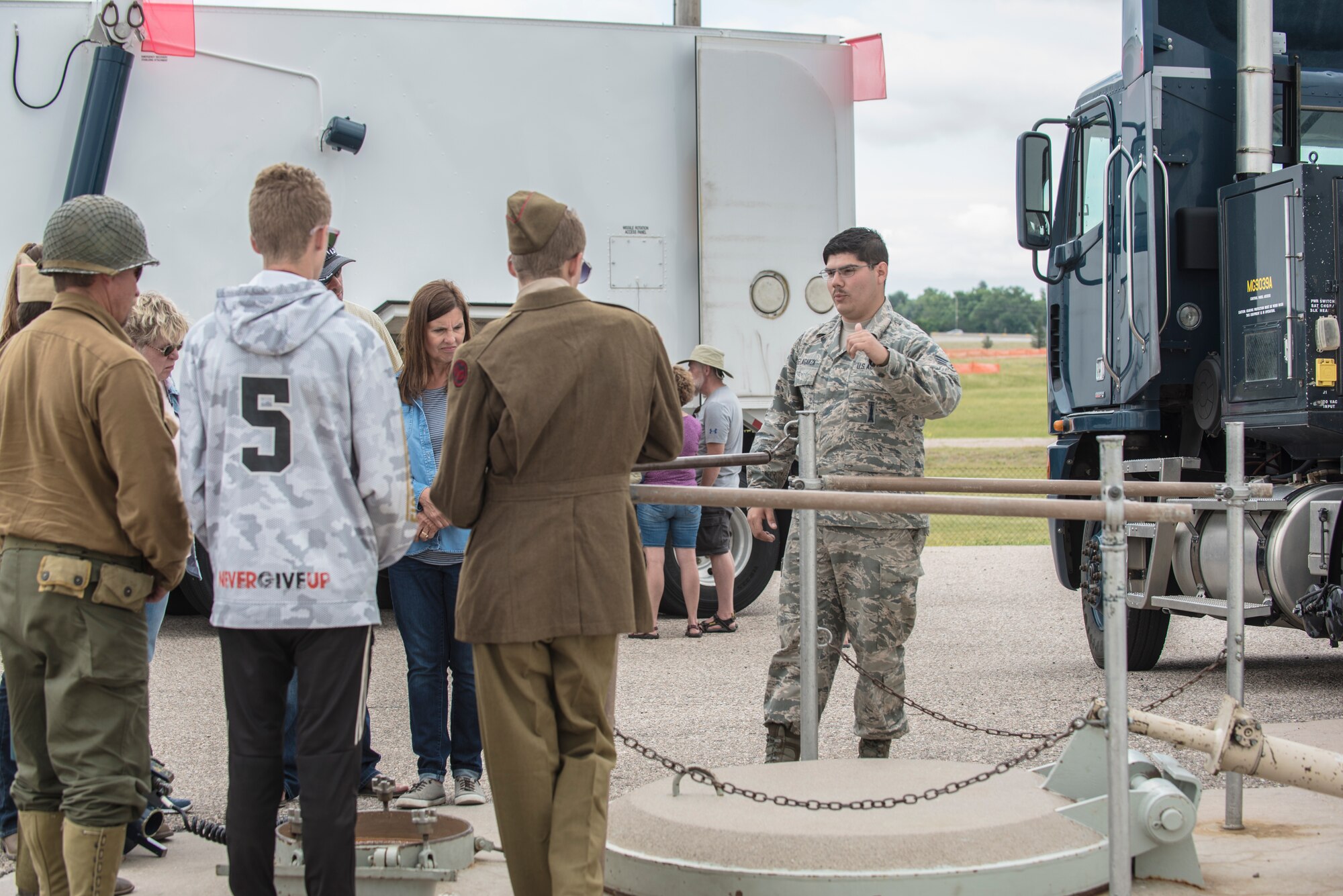 Senior Airman Cedric Delagarza, 90th Missile Maintenance Squadron missile handling team technician, shows a military vehicle to members of the local community during a tour of Uniform-01, a Minuteman III ICBM launch facility trainer at F.E. Warren Air Force Base, Wyo., July 20, 2019. These tours allow the community an opportunity to see how a launch facility operates. Fort D.A. Russell Days provides the public an opportunity to celebrate and learn about the base’s rich history. (U.S. Air Force photo by Senior Airman Abbigayle Williams)