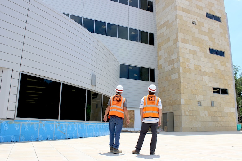 Baltimore District Construction Representatives, Robbie Powers and Martin Dougherty, stand within SAOF's courtyard on Fort Belvoir, Va. July 1, 2019. The U.S. Army Corps of Engineers, Baltimore District, is putting the finishing touches on a state-of-the-art 381,000-square-foot SAOF that will provide the U.S. Army Intelligence and Security Command a consolidated administrative facility to well-equip them for future operations.