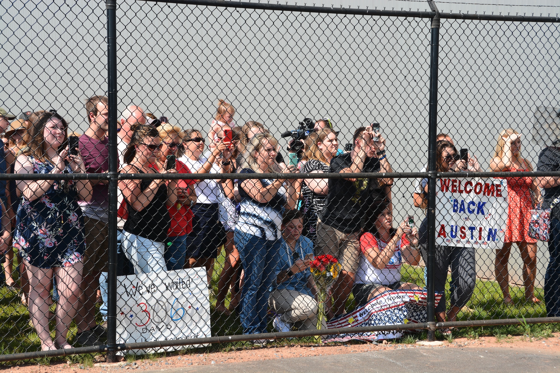 Families anxiously wait for their Soldiers to exit the plane.
