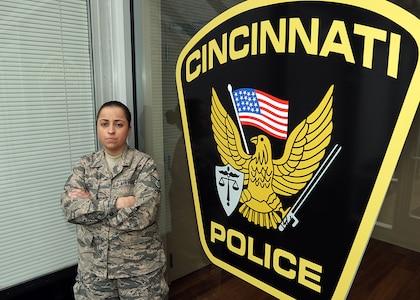 Ohio Air National Guard Tech. Sgt. Chelsea Lovelace, an analyst for the Ohio National Guard’s Counterdrug Task Force, stands for a photo at the Cincinnati Police Department’s Narcotics Division. Lovelace lost her father to a morphine pill overdose and now works to get drugs off the streets of greater Cincinnati.