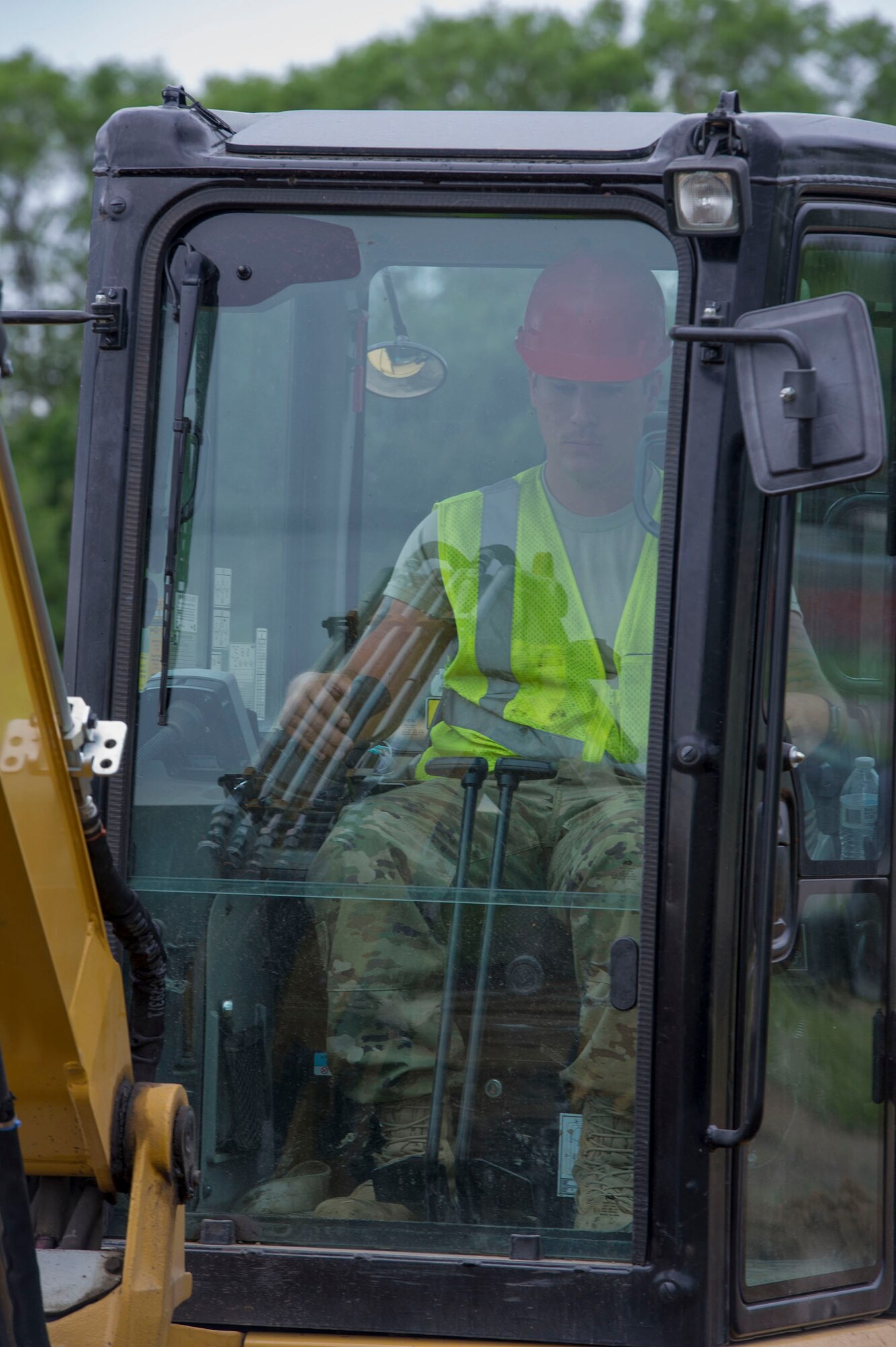 Tech. Sgt. Jonathan Liebherr, 560th RED HORSE Squadron site lead, operates an excavator at a construction site on Minneapolis-St. Paul Air Reserve Station, Minn., June 11, 2019.