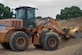 Master Sgt. Johnny Cunningham, 560th RED HORSE Squadron rotational NCO in charge, operates a front end loader at a construction site on Minneapolis-St. Paul Air Reserve Station, Minn., July 10, 2019.