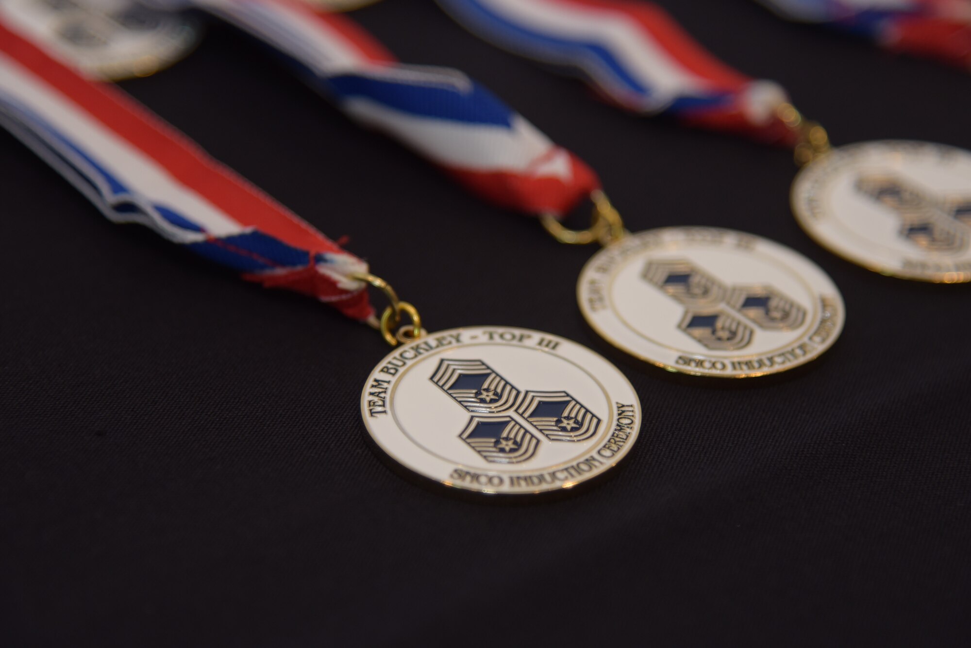 Team Buckley’s newest master sergeants and master sergeant selectees were honored with a medallion at the Senior NCO Induction Ceremony at Heritage Eagle Bend Golf Club in Aurora, Colo., July 19, 2019. The medallion shows the top three enlisted ranks and signifies the milestone these Airmen have achieved by attaining the rank of master sergeant.