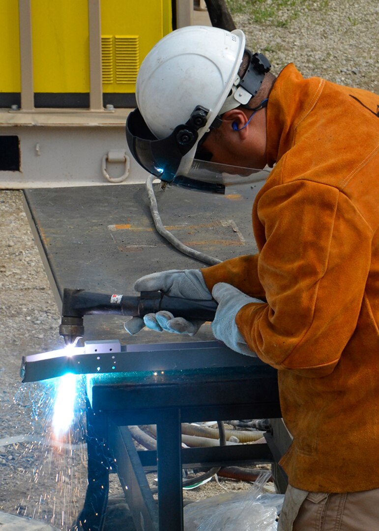 Kristian Fugrad, a property receipt supervisor at DLA’s disposal site in Sagami, Japan, operates a plasma torch while demilitarizing property turned in during OCORT ’19 in Michigan.