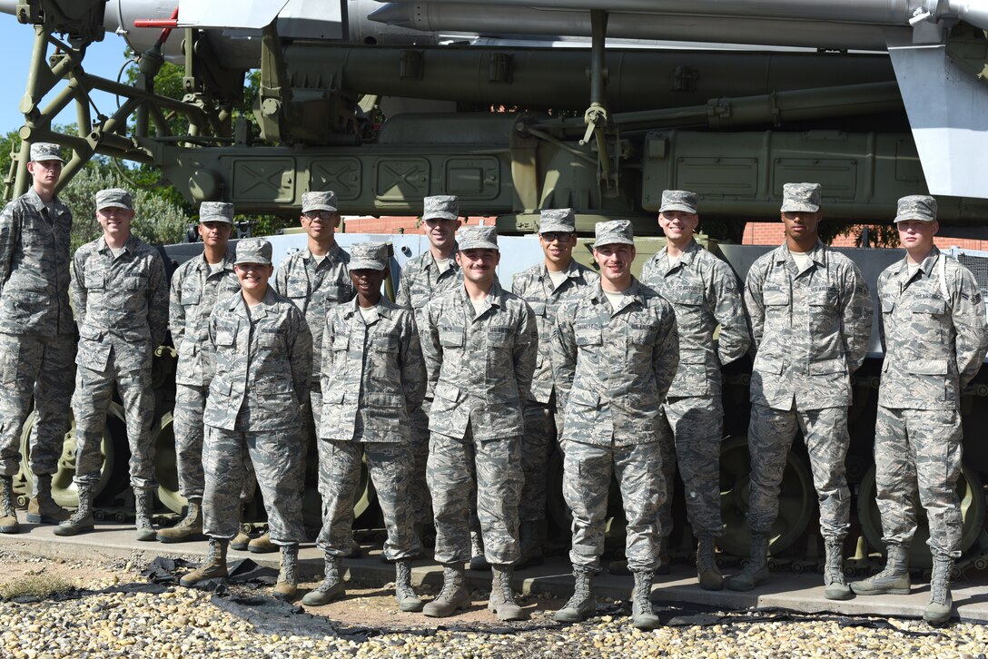 U.S. Air Force students from the first class of the redesigned course for the Targeting Analyst career field stand for a photo outside Di Tommaso Hall on Goodfellow Air Force Base, Texas, July 17, 2019. This new course is designed to incorporate more hands on training and prepare the Airmen for their first duty station. (U.S. Air Force photo by Senior Airman Seraiah Wolf/Released)
