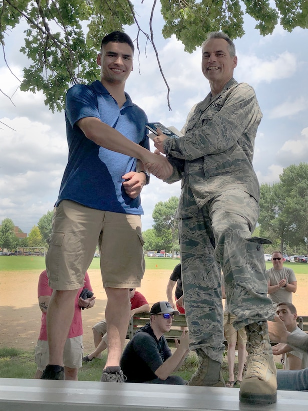 Senior Airman Vincent Kerkes, 934th Aircraft Maintenance Squadron integrated flight control systems specialist, was presented the Lt. Gen. Leo Marquez Award by Col. Anthony Polashek, 934th Airlift Wing commander, during a maintenance picnic on Minneapolis-St. Paul Air Reserve Station, Minn., July 14, 2019.