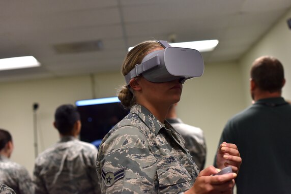 U.S. Air Force Airman 1st Class Teara Jones, a 315th Training Squadron student, uses a virtual reality system to identify aircraft as they fly past her in the new program designed for the Targeting Course in Brandenburg Hall on Goodfellow Air Force Base, Texas, July 11, 2019. The students were able to try different programs during this portion of their training, each with a different goal to help students with their career field. (U.S. Air Force photo by Senior Airman Seraiah Wolf/Released)