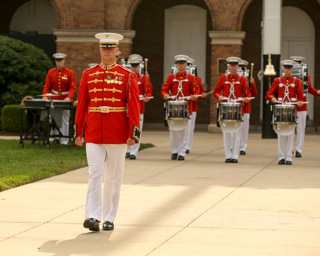 Marines with Marine Barracks Washington D.C. conduct pass in review during a passage of command ceremony at Marine Barracks Washington, D.C., July 11, 2019. General Robert B. Neller relieved his duties as 37th Commandant of the Marine Corps to Gen. David H. Berger, 38th Commandant of the Marine Corps. (U.S. Marine corps photo by Pfc. Allen Sanders)