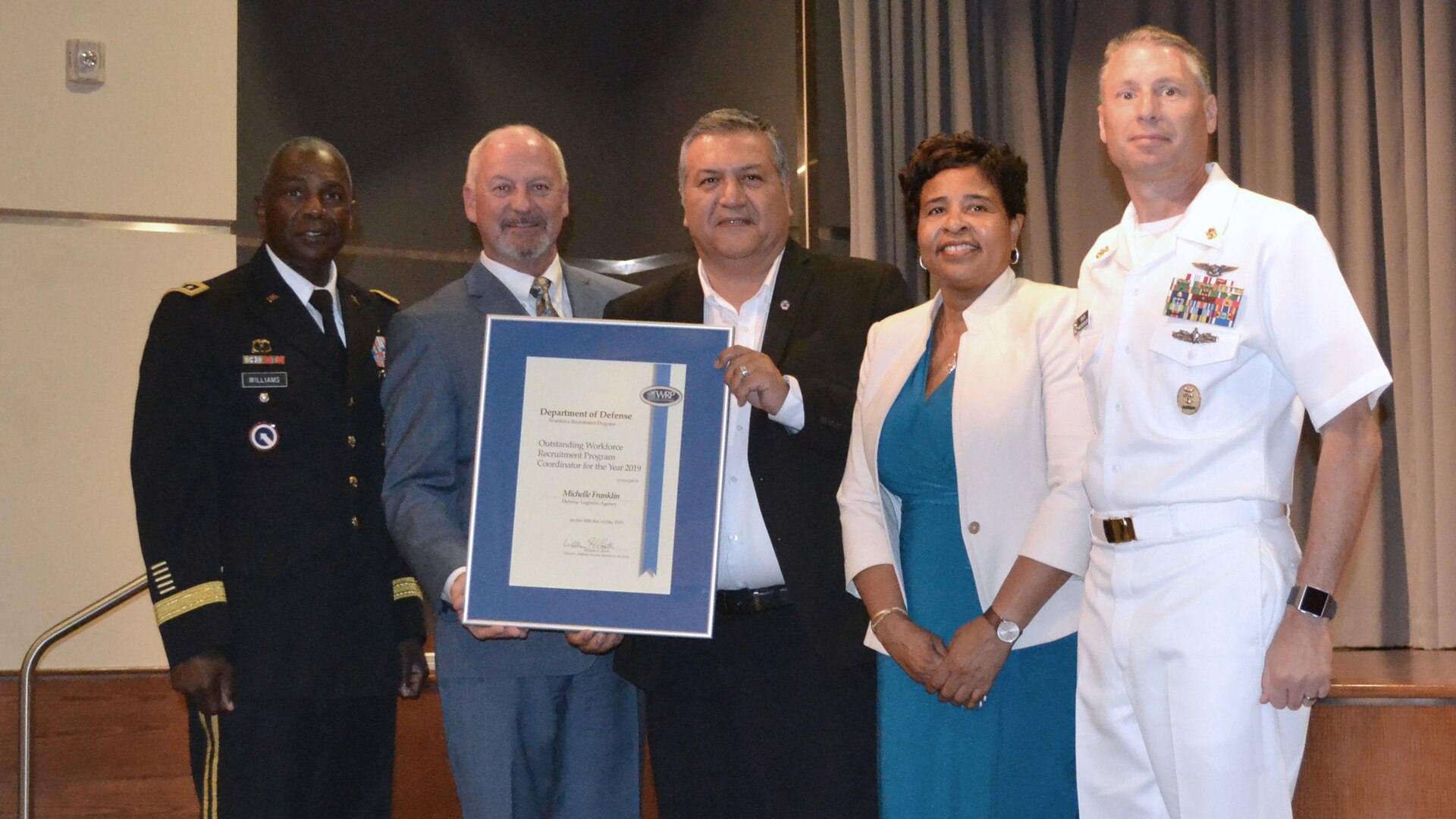Winners and DLA representatives pose for a photo during the Defense Department’s 2018 Workforce Recruitment Program Awards ceremony July 18 in Alexandria, Virginia. From left: DLA Director Army Lt. Gen. Darrell Williams; Brian Davis, director, Defense Personnel and Family Support Center; Gilberto Vargas, EEO specialist, DLA Disposition Services (accepting for WRP Coordinator of the Year Michelle Franklin); DLA EEO and Diversity Director Janice Samuel; and DLA Senior Enlisted Leader Navy Command Master Chief Shaun Brahmsteadt
