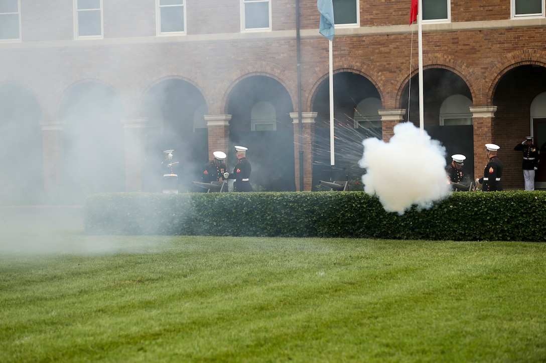 Body Bearers with Bravo Company, Marine Barracks Washington D.C., fire cannons during a passage of command ceremony at Marine Barracks Washington, D.C., July 11, 2019. General Robert B. Neller relieved his duties as 37th Commandant of the Marine Corps to Gen. David H. Berger, 38th Commandant of the Marine Corps. (U.S. Marine corps photo by Pfc. Allen Sanders)