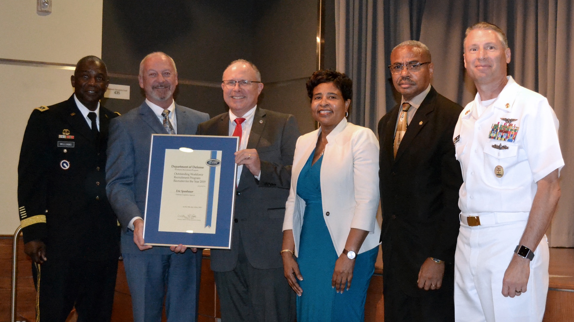 Winners and DLA representatives pose for a photo during the Defense Department’s 2018 Workforce Recruitment Program Awards ceremony July 18 in Alexandria, Virginia. From left: DLA Director Army Lt. Gen. Darrell Williams; Brian Davis, director, Defense Personnel and Family Support Center; WRP Recruiter of the Year Eric Spanbauer; DLA EEO and Diversity Director Janice Samuel; EEO Staff Director Russell Lowe; and DLA Senior Enlisted Leader Navy Command Master Chief Shaun Brahmsteadt