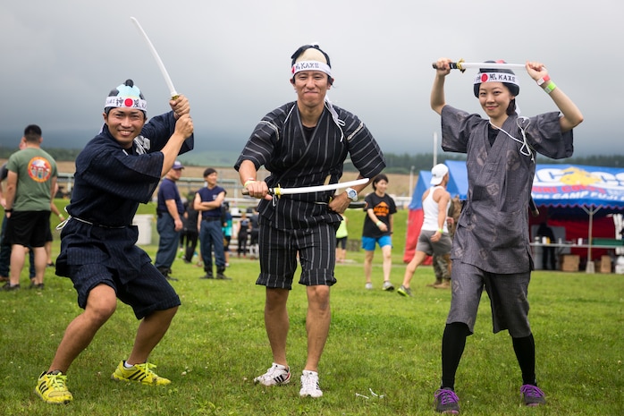 Members of the local community pose for a group photo before Combined Arms Training Center Camp Fuji’s inaugural Samurai Run July 21, 2019. The Marine Corps Community Services event was held as a chance for locals and service members to strengthen relationships through friendly competition.