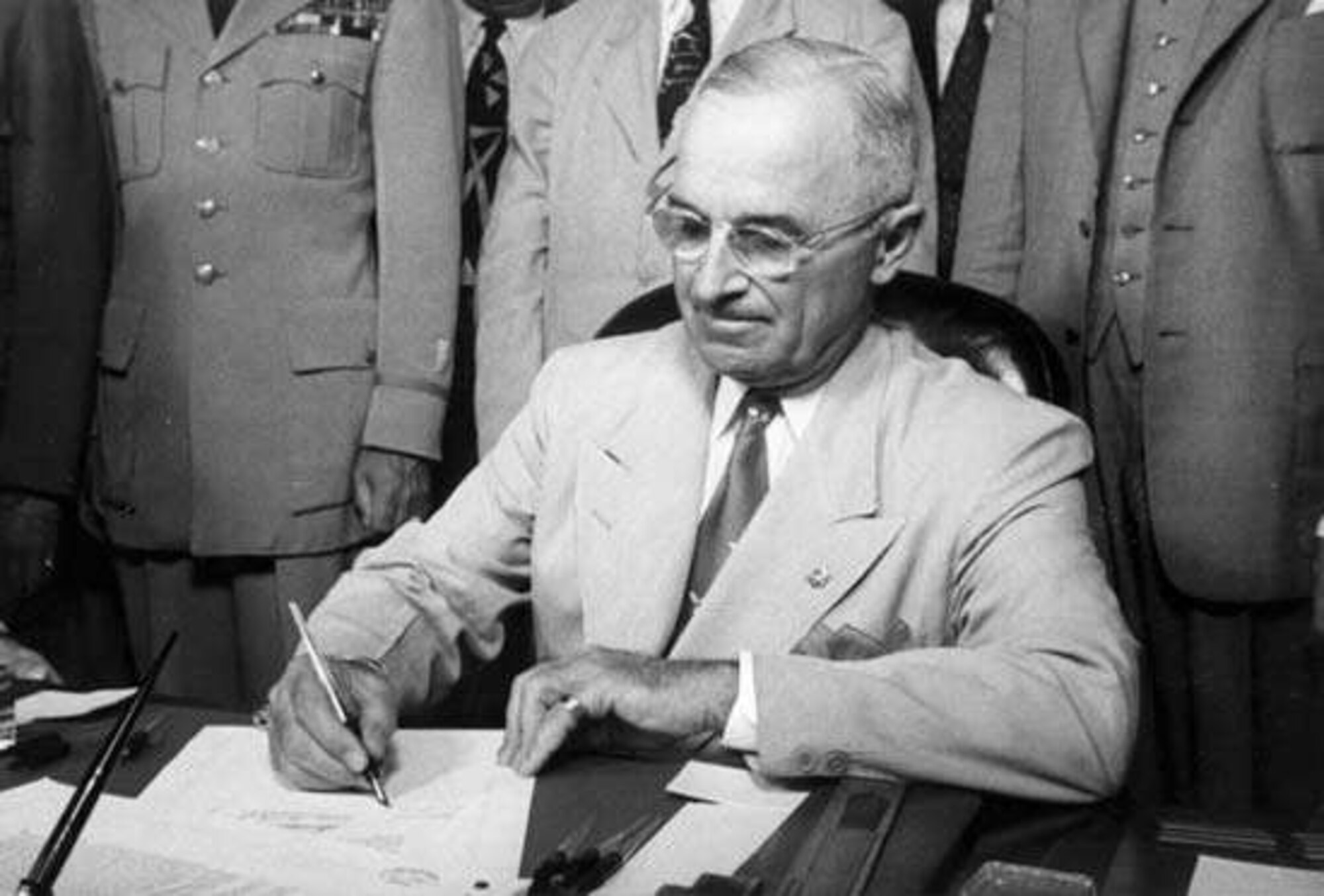 President Harry S. Truman signs the National Security Act into law in the Oval office, Washington D.C., July 26, 1947.