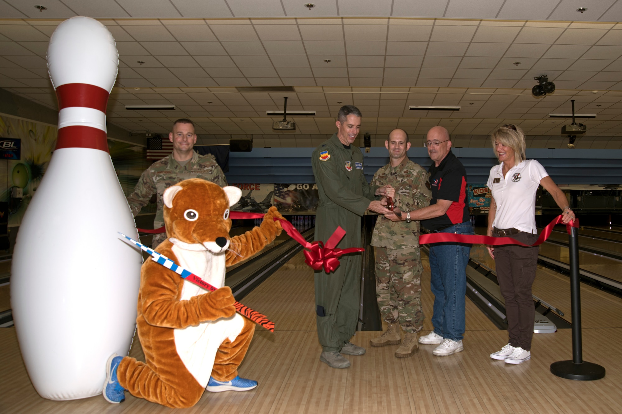 U.S. Air Force Col. Derek O’Malley, 20th Fighter Wing (FW) commander, center left, participates in a ribbon cutting ceremony with 20th FW Airmen at the 20th Force Support Squadron Shaw Lanes Bowling Center at Shaw Air Force Base, South Carolina, July 19, 2019.