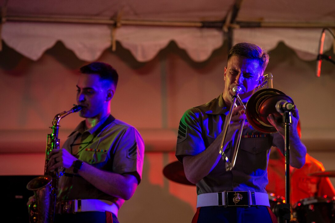 Two Marines playing instruments.