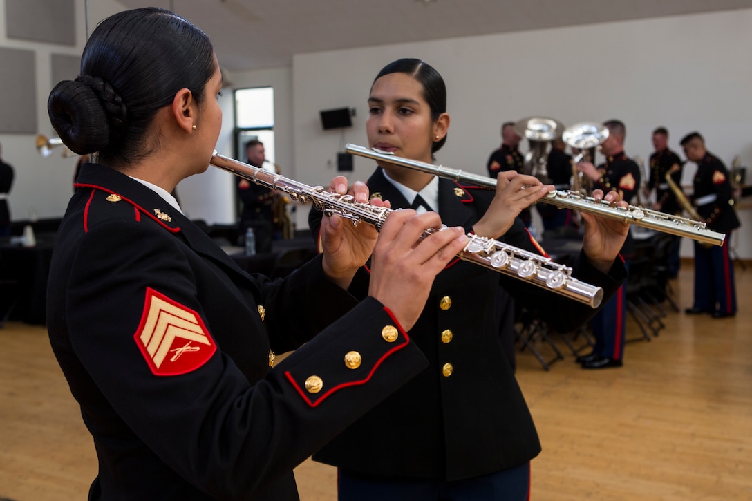 U.S. Marine Corps Sgt. Angelica Mora, a flute instrumentalist with the 3rd Marine Aircraft Wing (MAW) Band, observes herself playing prior to performing at the California Center for the Arts, Escondido, Calif., July 4, 2019. The 3rd MAW Band spent countless hours of preparation into “An American Celebration” performance, which commemorated Independence Day. (U.S. Marine Corps photo by Lance Cpl. Levi J. Guerra)