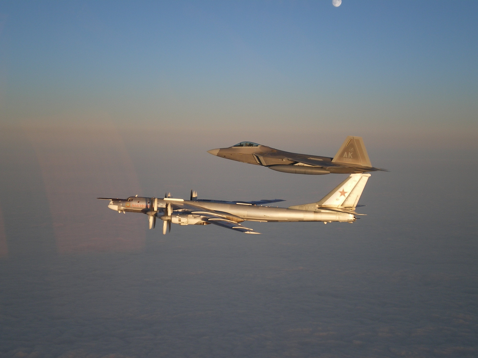 A U.S. Air Force F-22 Raptor assigned to Joint Base Elmendorf-Richardson intercepts a Russian Tupolev Tu-95 bomber.