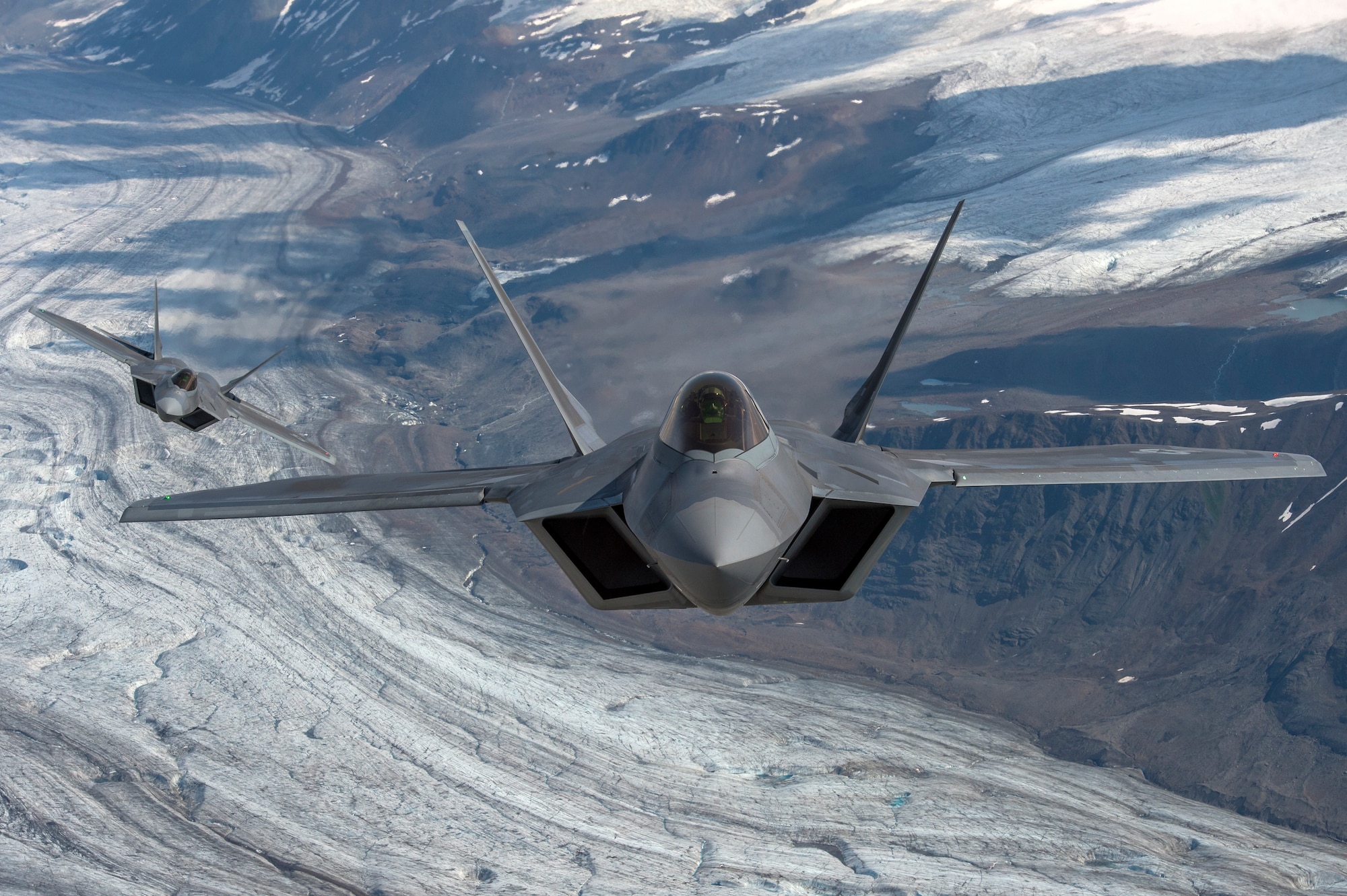 U.S. Air Force F-22 Raptors from Joint Base Elmendorf-Richardson, fly in formation over the Joint Pacific Alaska Range Complex, July 18, 2019.