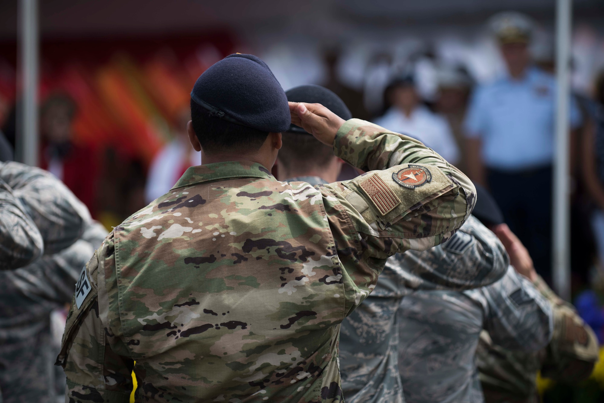 Team Andersen Airmen slaute the Grand Stand during the 75th Liberation Day parade July 21, 2019.