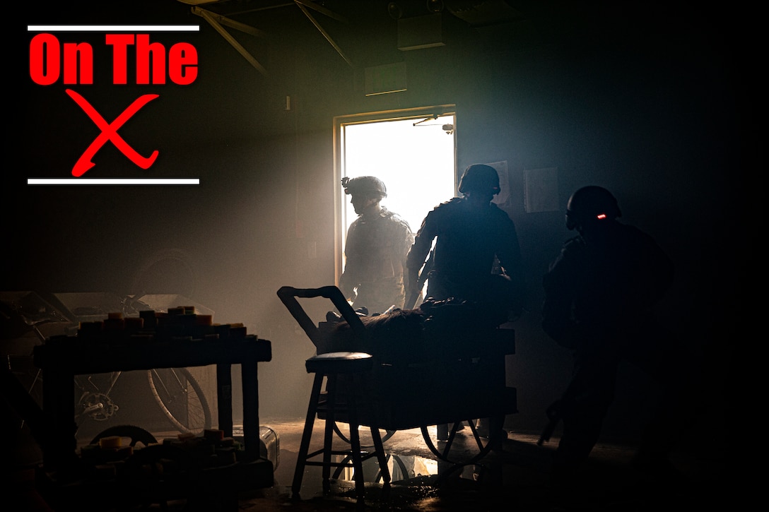 U.S. Marines rush into the Medical Simulation Training Center for their final evaluation after a Tactical Combat Casualty Care course on Camp Hansen, Okinawa, Japan, July 11, 2019. The MSTC trains Marines, throughout III Marine Expeditionary Force, in Combat Life Saving, TCCC and other field medical courses with the mission of eliminating preventable deaths on the battlefield. (U.S. Marine Corps photo by Cpl. Jamin M. Powell)