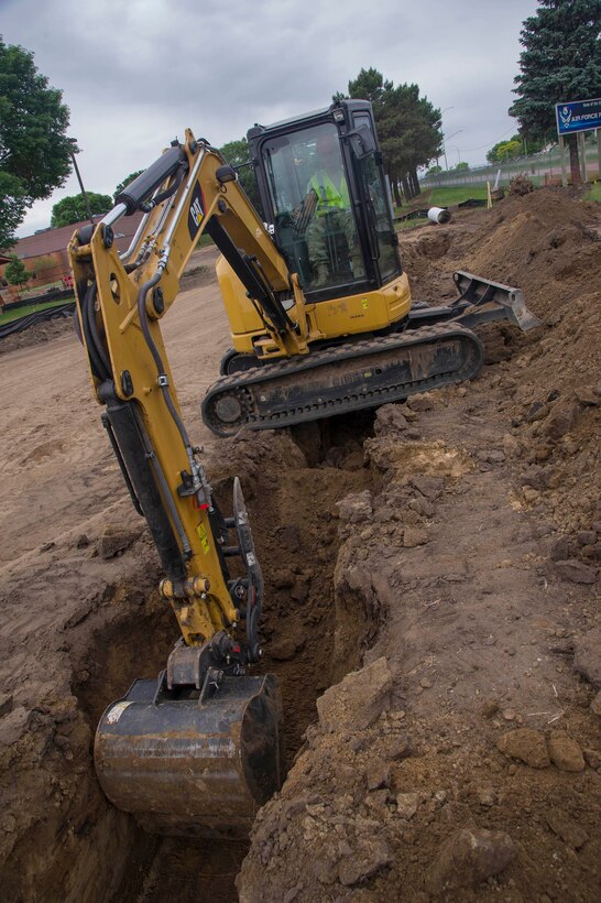 Tech. Sgt. Jonathan Liebherr, 560th RED HORSE Squadron site lead, digs a trench with an excavator at a construction site on Minneapolis-St. Paul Air Reserve Station, Minn., June 11, 2019.