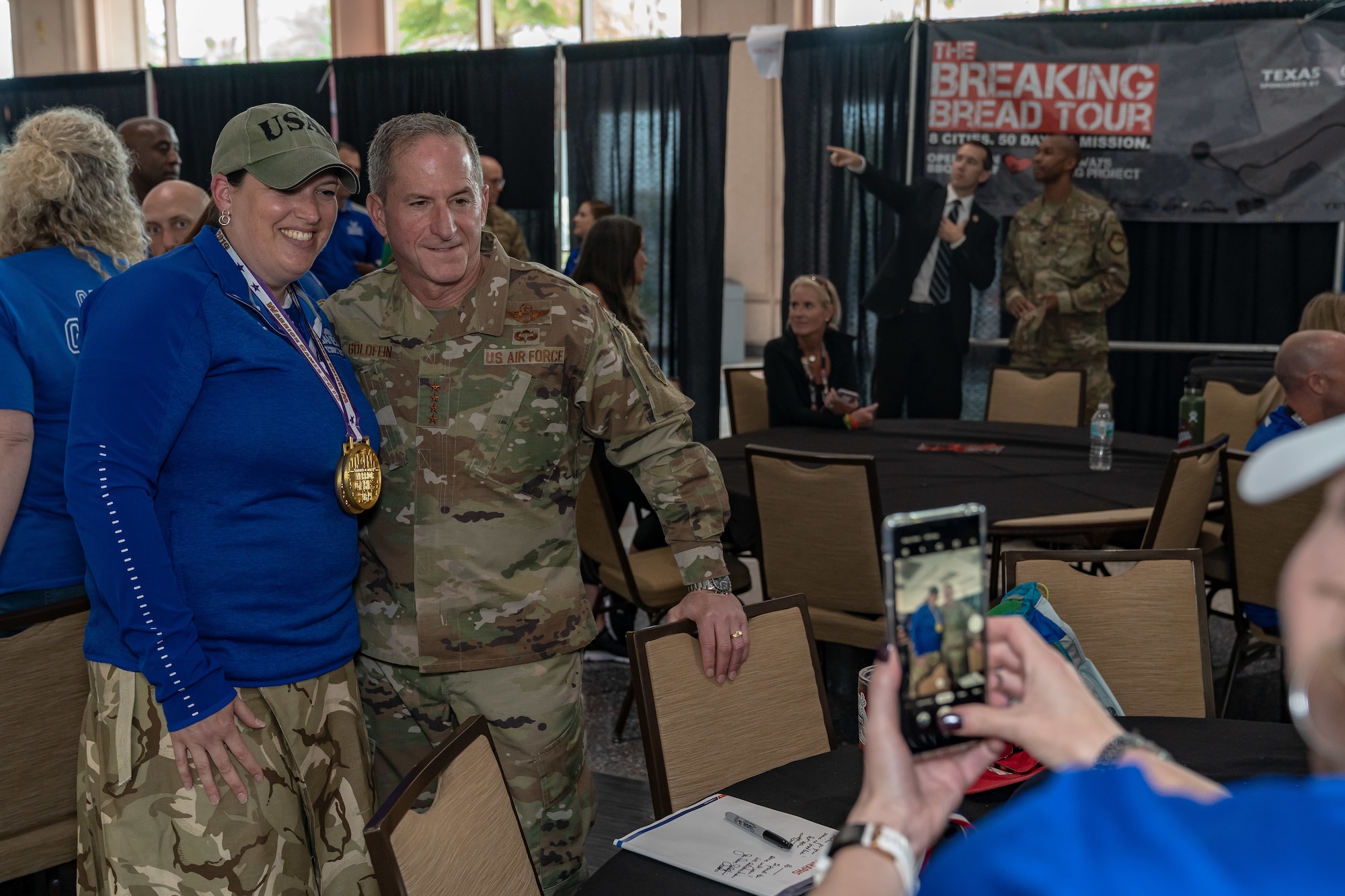 Air Force Chief of Staff Gen. David L. Goldfein and Tech Sgt. Roann R. Leatz, Team Air Force athlete, pose for a photo at the 2019 Department of Defense Warrior Games at Tampa, Fla, June 28, 2019. Warrior Games athletes have overcome significant physical and psychological challenges, not always visible to others and have demonstrated that life continues after becoming wounded, ill or injured. (U.S. Air Force photo by Tech Sgt. Lionel Castellano)