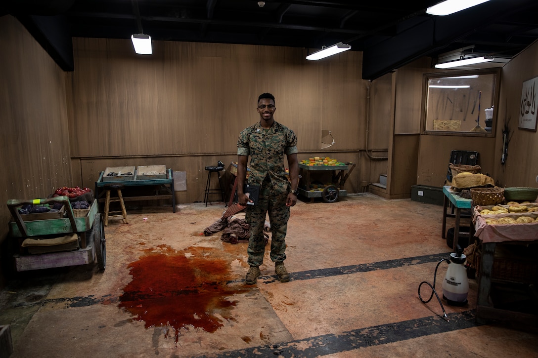 U.S. Navy Hospital Corpsman Tavish Davis prepares to assess Marines at the end of a Tactical Combat Casualty Care course on Camp Hansen, Okinawa, Japan, July 11, 2019. The Medical Simulation Training Center trains Marines throughout III Marine Expeditionary Force in Combat Life Saving, TCCC and other field medical courses with the mission of eliminating preventable deaths on the battlefield. Davis, a native of Houston, Texas, is an instructor with the MSTC. (U.S. Marine Corps photo by Cpl. Jamin M. Powell)