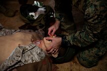 U.S. Marine Corps Maj. Zach Worth puts a nasopharyngeal airway in a medical mannequin during a Tactical Combat Casualty Care course on Camp Hansen, Okinawa, Japan, July 11, 2019. The Medical Simulation Training Center trains Marines, throughout III Marine Expeditionary Force, in Combat Life Saving, TCCC and other field medical courses with the mission of eliminating preventable deaths on the battlefield. Worth, a native of The Dalles, Oregon, is an MV-22 Osprey pilot with Marine Aviation Group 36, 1st Marine Aircraft Wing. (U.S. Marine Corps photo by Cpl. Jamin M. Powell)