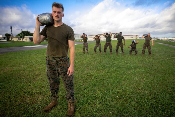 “The best way to come together, is doing the things you really don’t want to do together,” said U.S. Marine Corps Cpl. Ryan Harvey while leading his shop during physical training Camp Kinser, Okinawa, Japan, July 17, 2019. Harvey, a native of Buffalo, New York is a combat graphics specialist with Headquarters Company, Combat Logistics Regiment 37, 3rd Marine Logistics Group. (U.S. Marine Corps photo by Pfc. Courtney A. Robertson)
